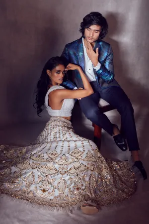 Rhino Grey Plunged-neck Blouse paired with Golden Net-ruffled Ghaghra and Dupatta