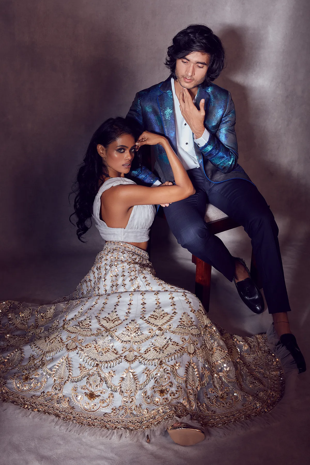 Rhino Grey Plunged-neck Blouse paired with Golden Net-ruffled Ghaghra and Dupatta